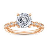 Roségoldener Verlobungsring mit großem Zirkonia und verzierten Seitensteinen