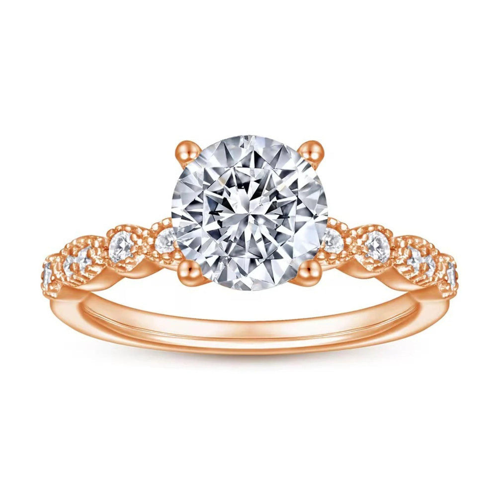 Roségoldener Verlobungsring mit großem Zirkonia und verzierten Seitensteinen