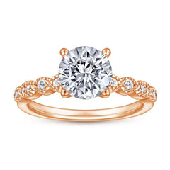 Roségoldener Verlobungsring mit großem Zirkonia und verzierten Seitensteinen