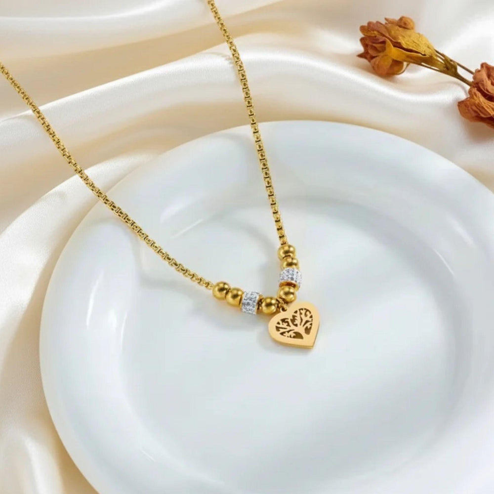 Goldene Edelstahlkette mit Herzanhänger und Lebensbaum von LOÉAR